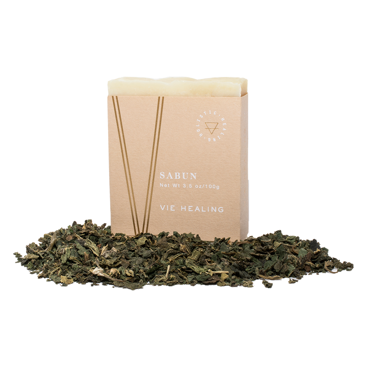 Nettle scented soap in a pile of nettles