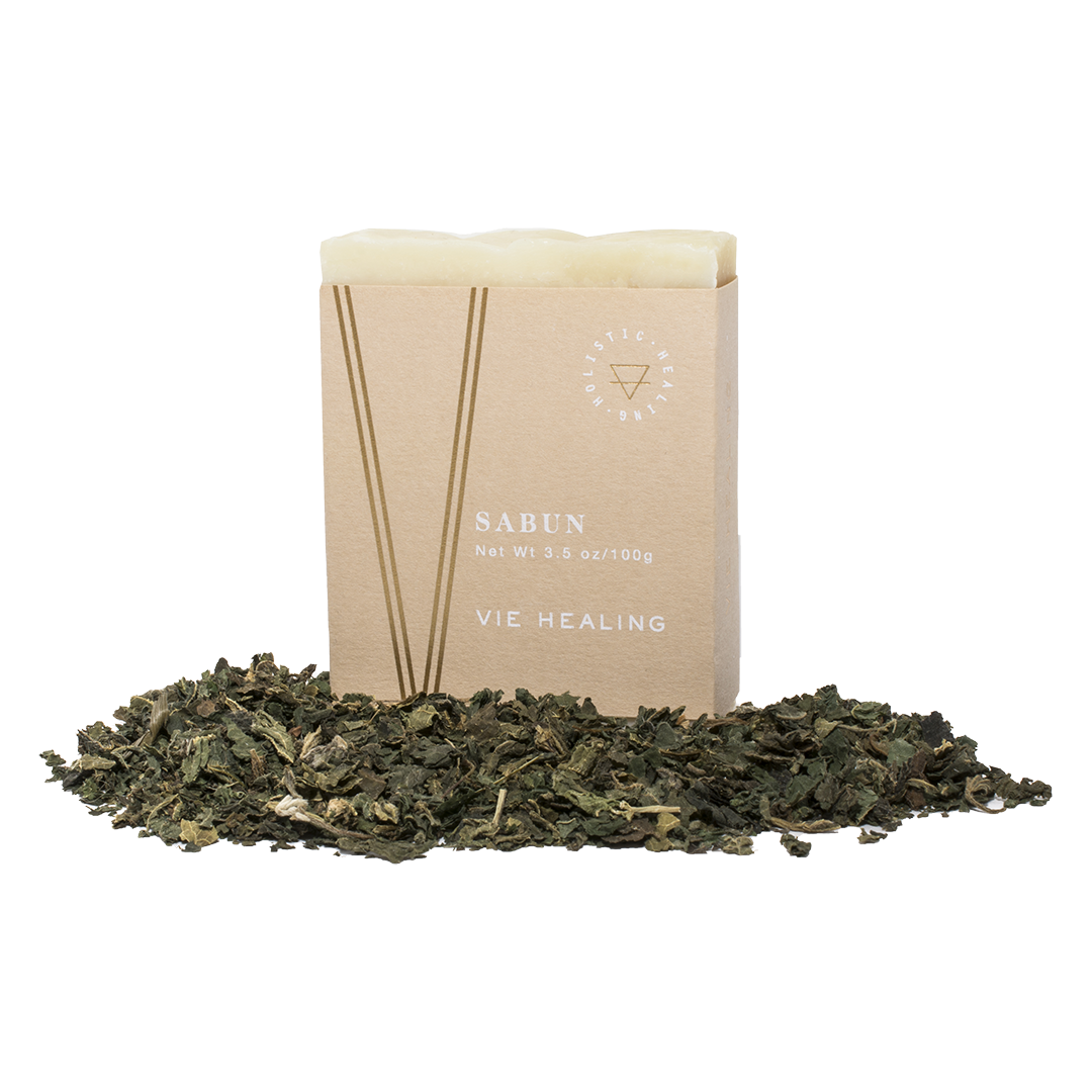 Nettle scented soap in a pile of nettles