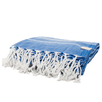 Blue Turkish towel with white trim folded